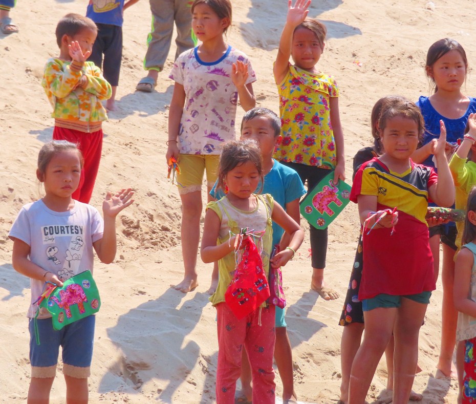 children waving goodbye